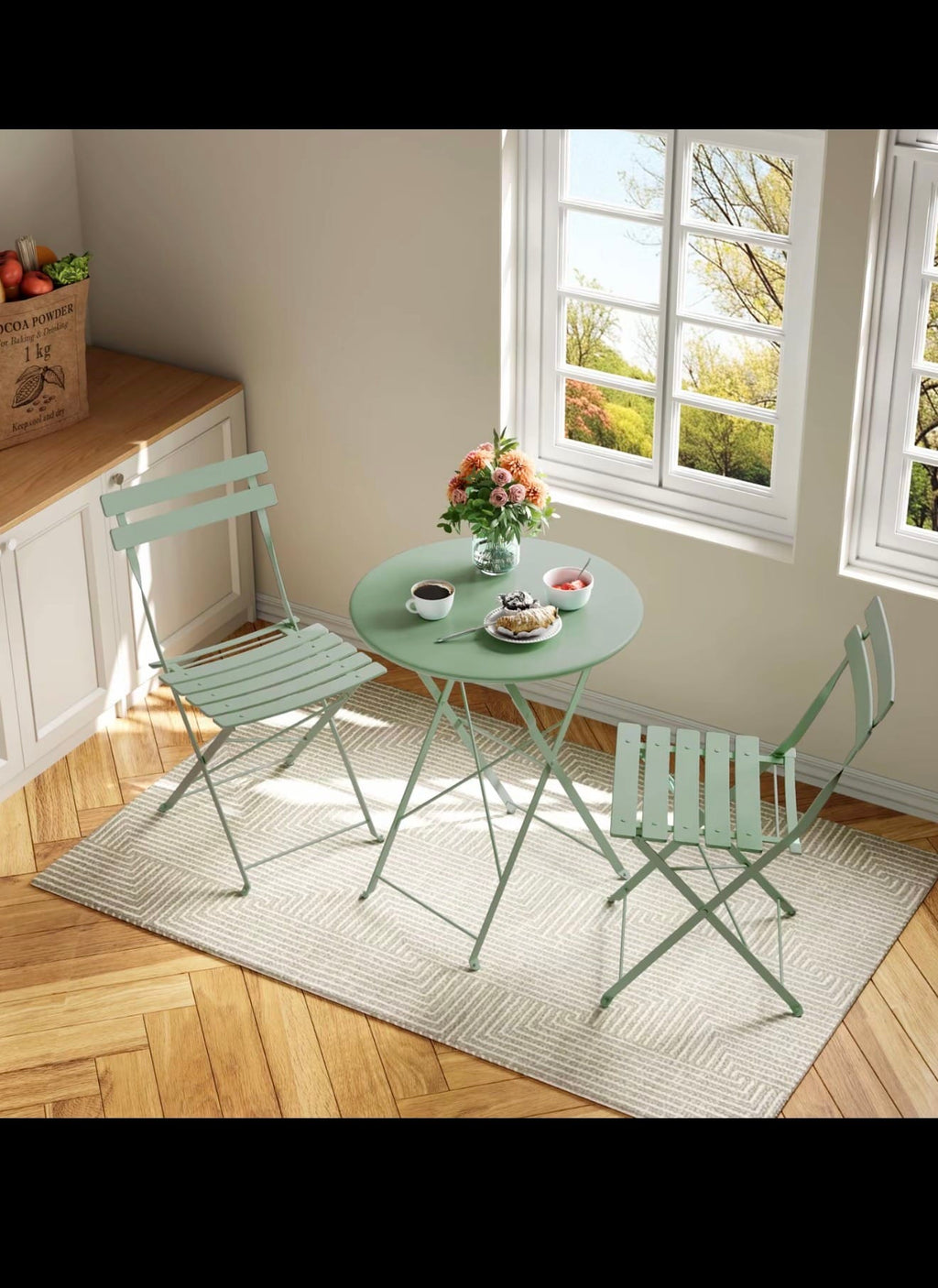 Pink folding metal bistro set indoors by window
